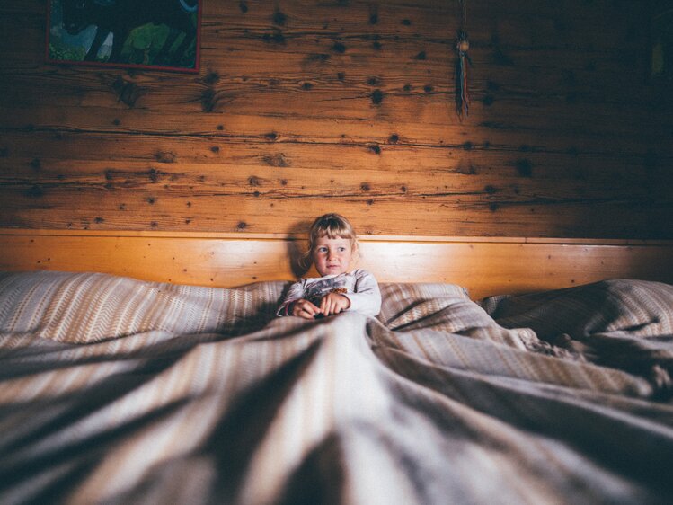 Kind liegt im Bett | © Urlaub am Bauernhof Kärnten / Daniel Gollner