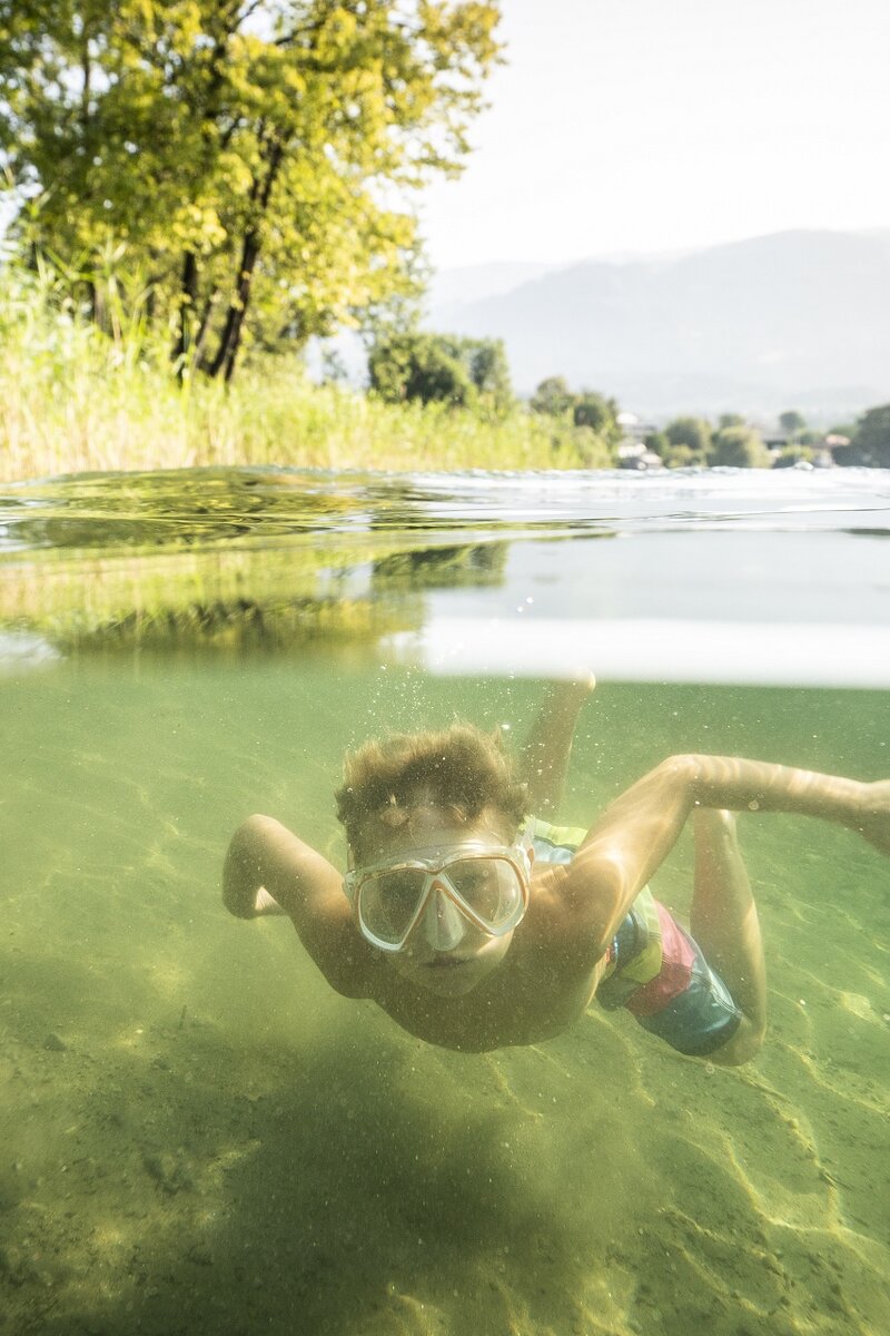 Kind mit Taucherbrille unter Wasser | © Gert Perauer / Millstätter See Tourismus GmbH