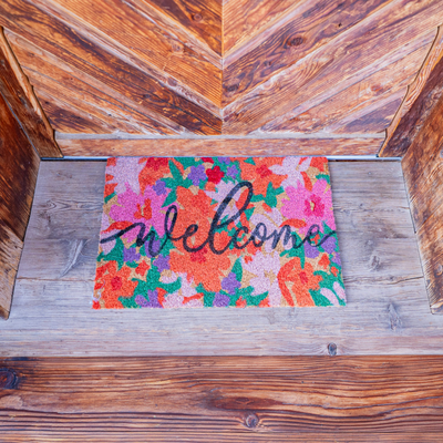 Welcome-Fußmatte am Eingang der Alm.