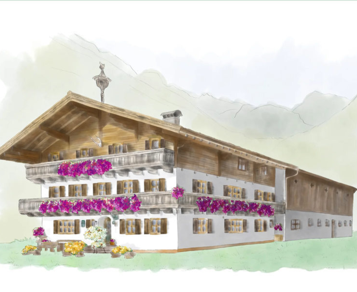 Das traditionelle Bauernhaus des Müllergut Bed and Breakfast mit blumengeschmückten Balkonen vor einer Bergkulisse.