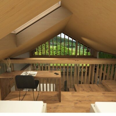 Ein gemütlicher Galeriebereich im Bauernhof mit einem Holzschreibtisch, Dachfenstern und Blick ins Grüne.