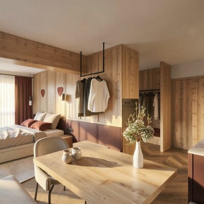 Appartement Frieda mit Doppelbett, Esstisch und Küchenzeile.