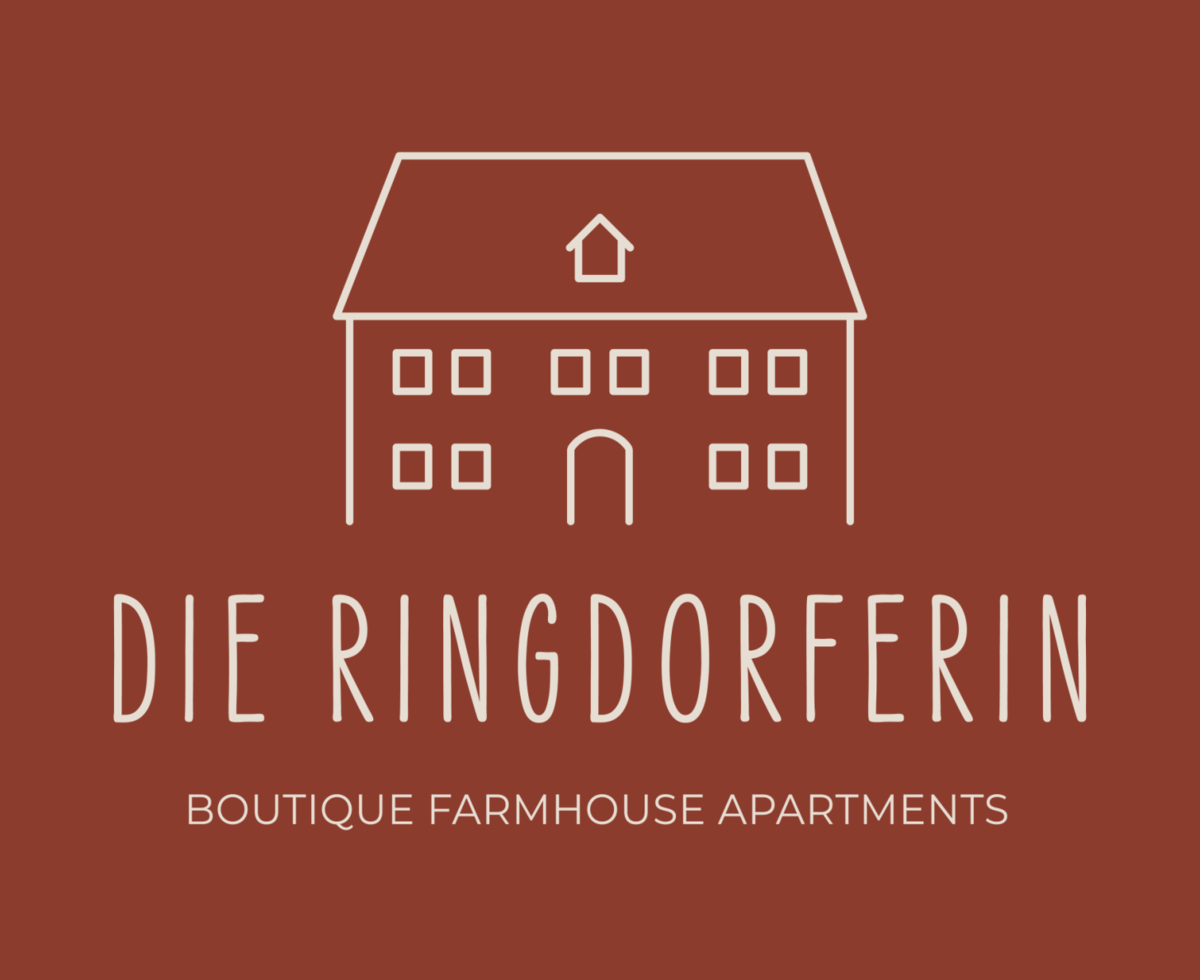 Das Logo des Bauernhofs 'Die Ringdorferin' mit einer stilisierten Gebäudedarstellung.