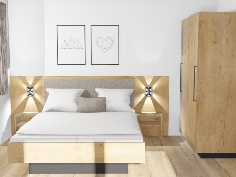Wir sind aktuell noch im Umbau, ab Dezember 2025 starten wir mit der Vermietung unserer neuen Ferienwohnung. Doppelbett im Bauernhof mit Nachttischen, Wandleuchten, einem Kleiderschrank und Fenster.
